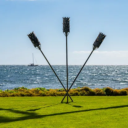 Tiki torches and an ocean view at Ma'alaea Surf Resort